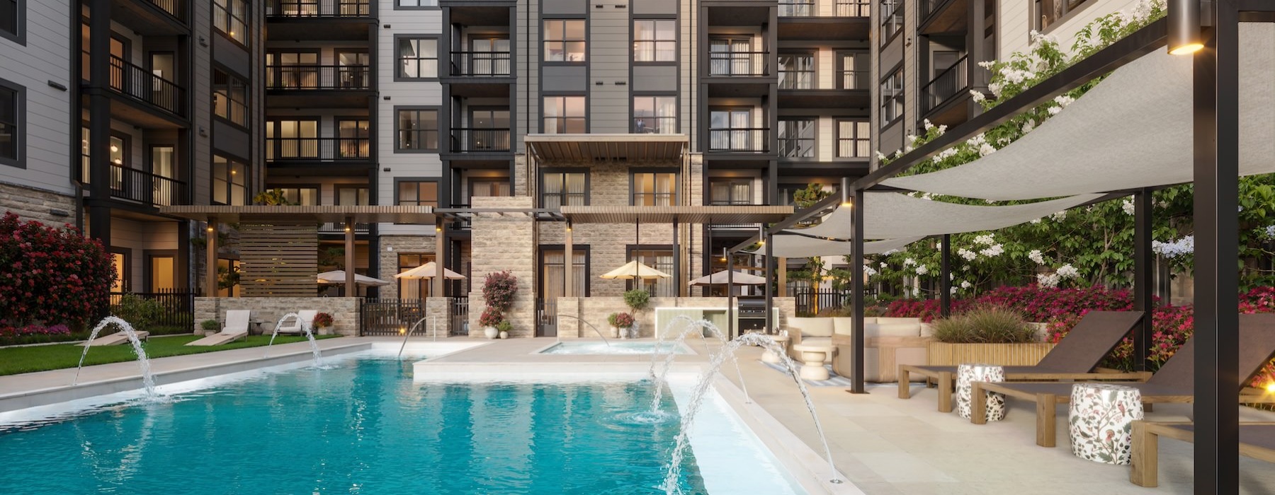a pool with lounge chairs in a courtyard