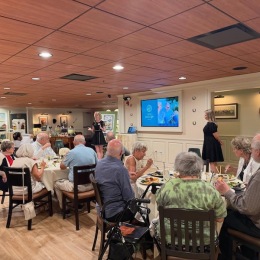 a group of people eating at an event