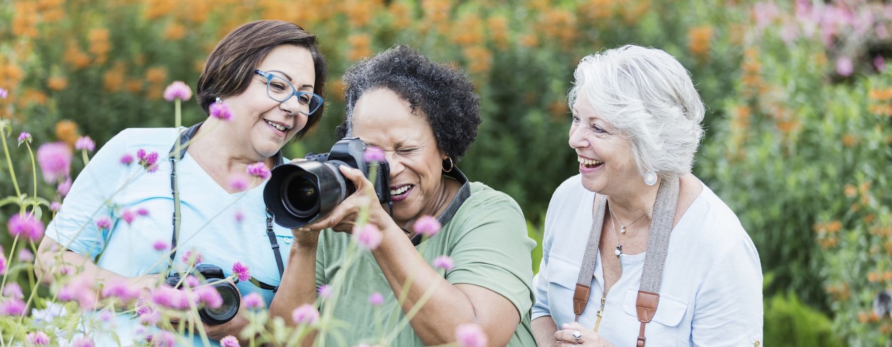 a group of women taking pictures