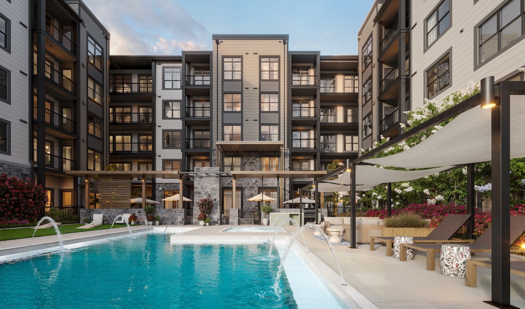 a pool with lounge chairs in a courtyard