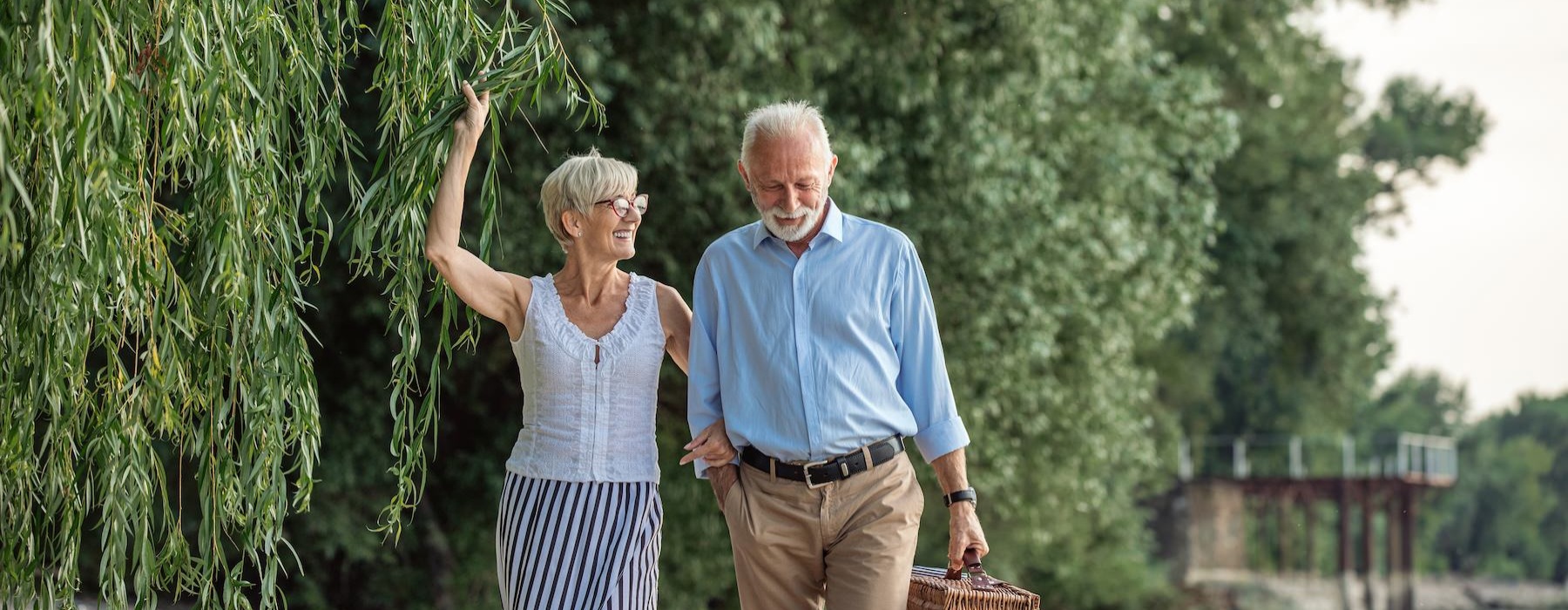 a man and woman holding a basket